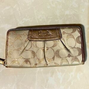 COACH signature Charlie C zip around wallet gold with purple interior